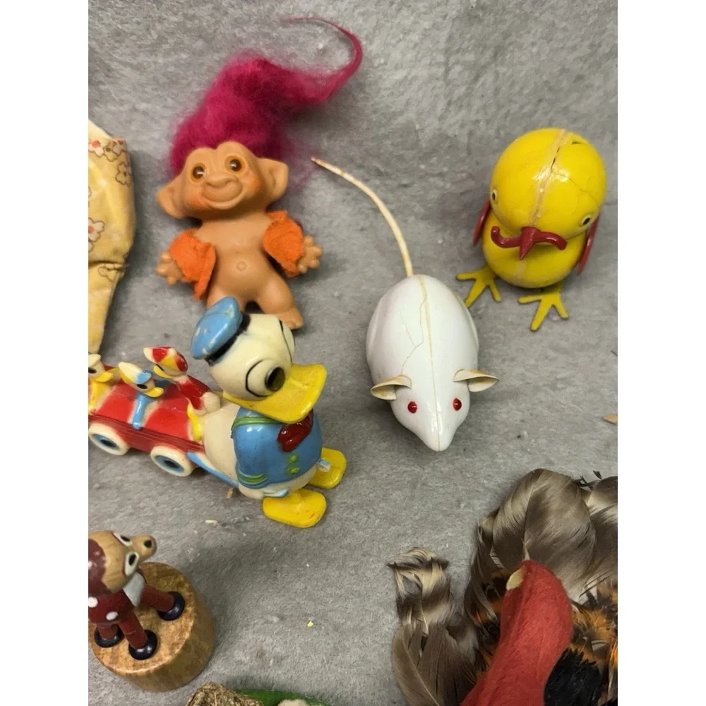 VINTAGE DOLL SUITCASE TRAFFIC SIGN PATTERN W/ MISC. CONTENTS DOLLS, TROLL, BIRDS